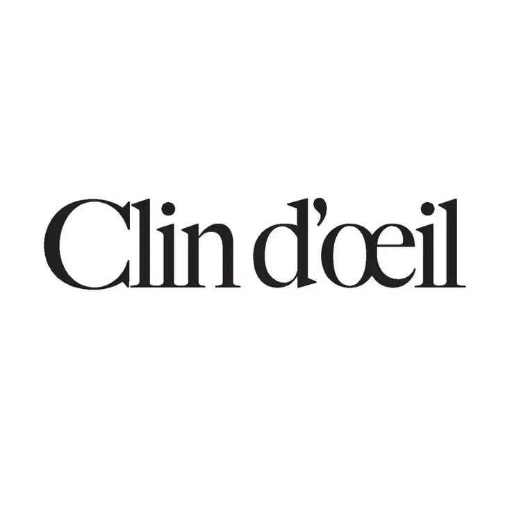Un logo en noir et blanc avec le texte « Clin d’œil ».